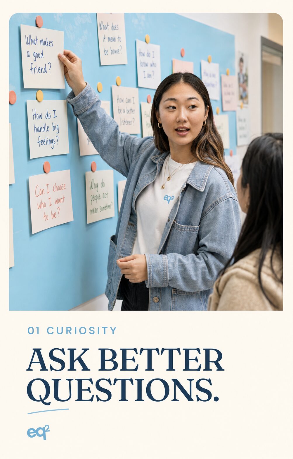 eq2 branded card: Emma Byun pointing to a wall covered in student sticky notes with questions like What makes a good friend? and How do I handle big feelings?, labeled 01 Curiosity, Ask Better Questions